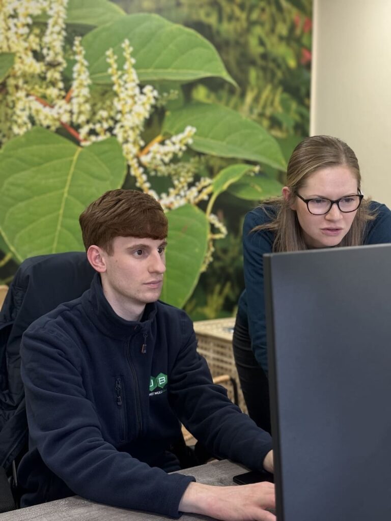 Two JBB Knotweed Solutions surveyors reviewing client survey to create a professional tailored management plan to treat Japanese Knotweed.