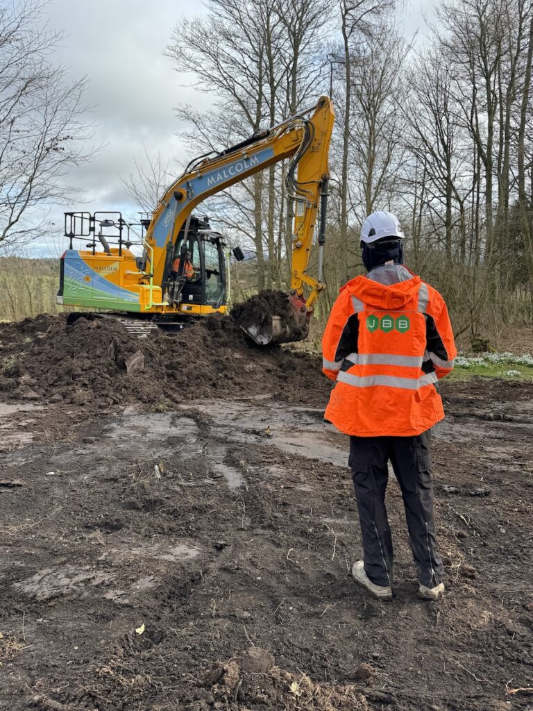 Supervised excavation of Japanese Knotweed at a commercial construction site, with JBB Knotweed Solutions overseeing works.